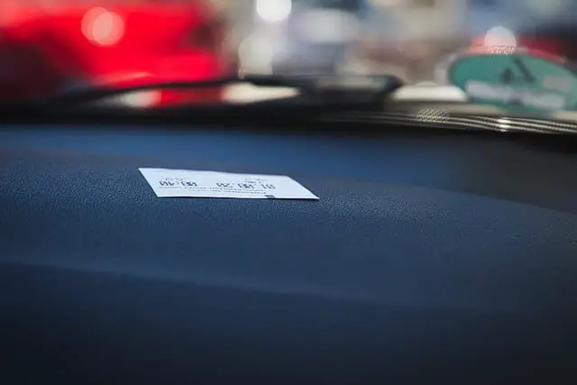 parking ticket on dashboard